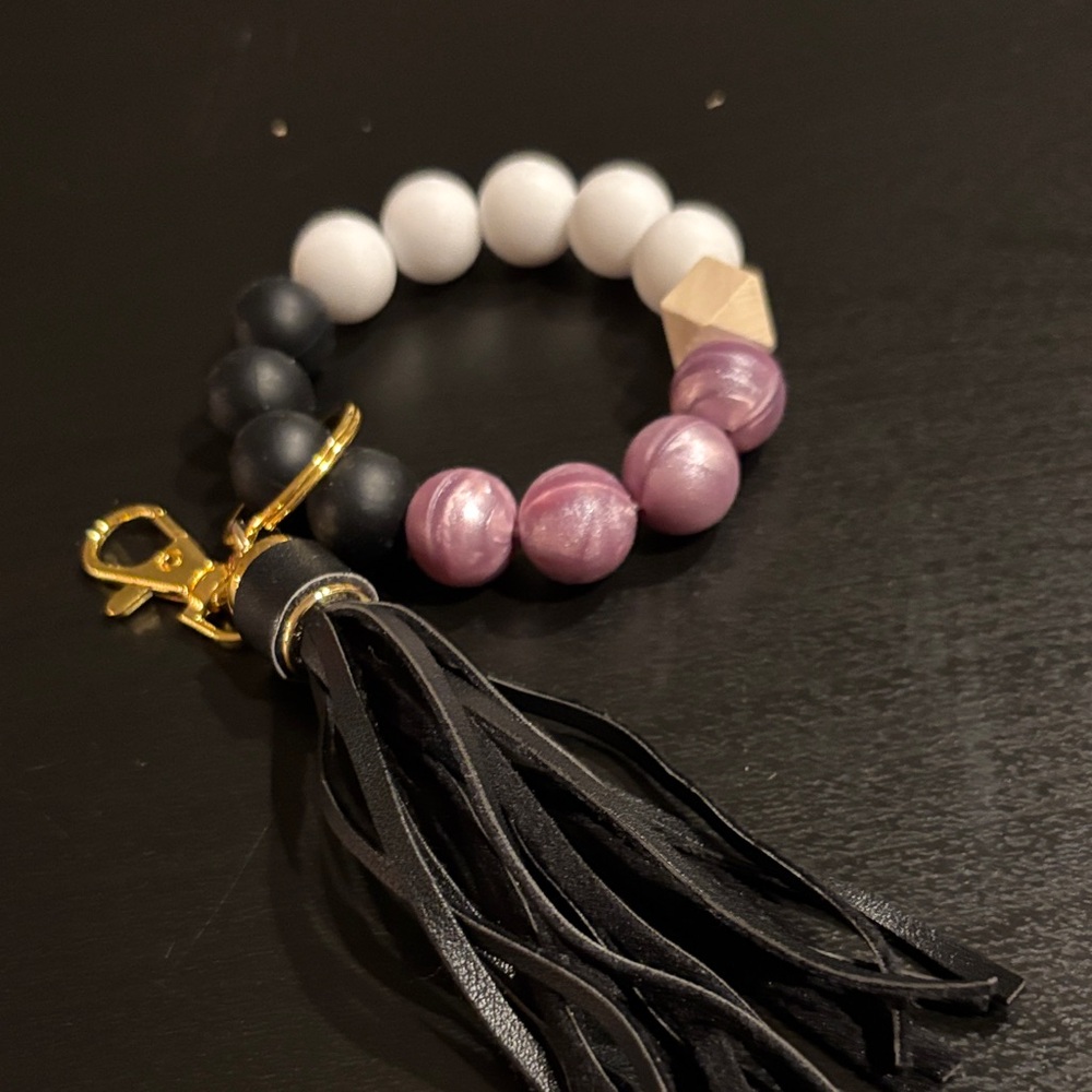 Elegant Black and White Beaded Bracelet with Tassel